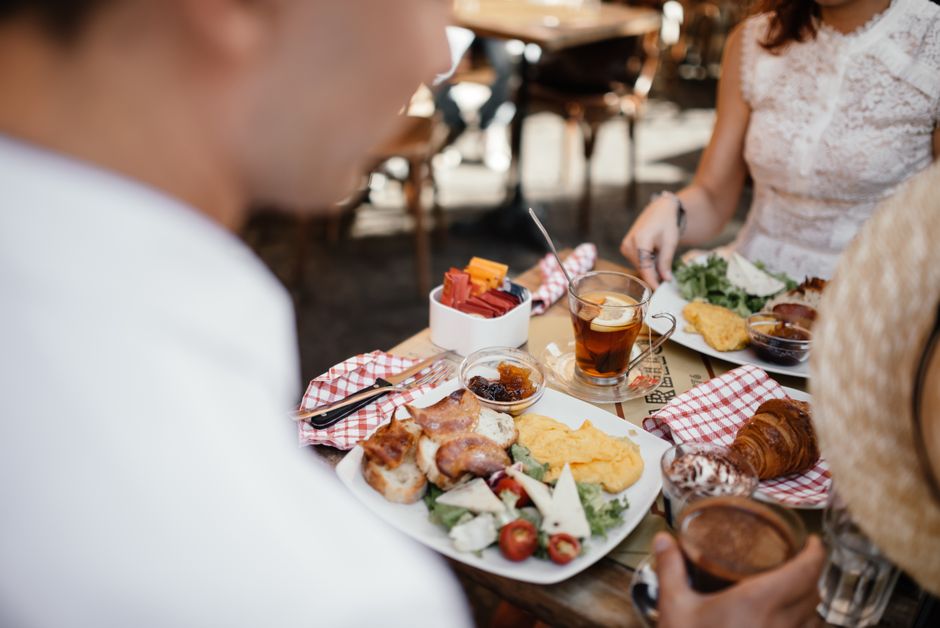 Restaurant team members dining together at an outdoor table
