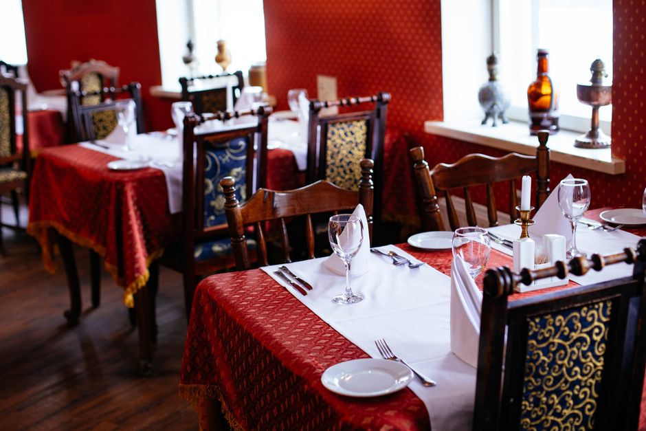 Fine dining restaurant with elegant place settings and glassware
